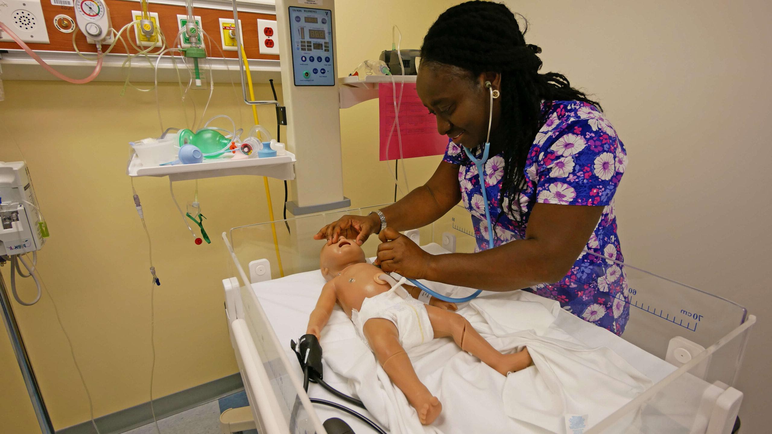 Photo of an RN-BSN student in a simulation lab at QCC
